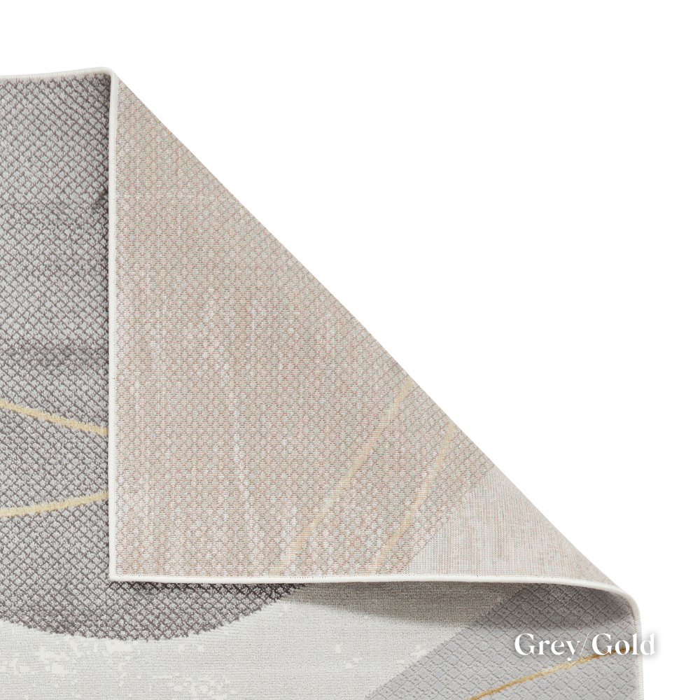Introduce fresh style with the Apollo Modern Abstract Machine Made Rugs featuring a blend of bold designs, metallic yarn and soft multi textured pile.