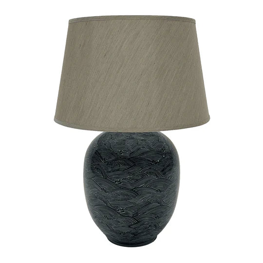 The Blue Waves Lamp is stunning showcase of traditional craftsmanship, crafted from ceramic and taupe linen shade