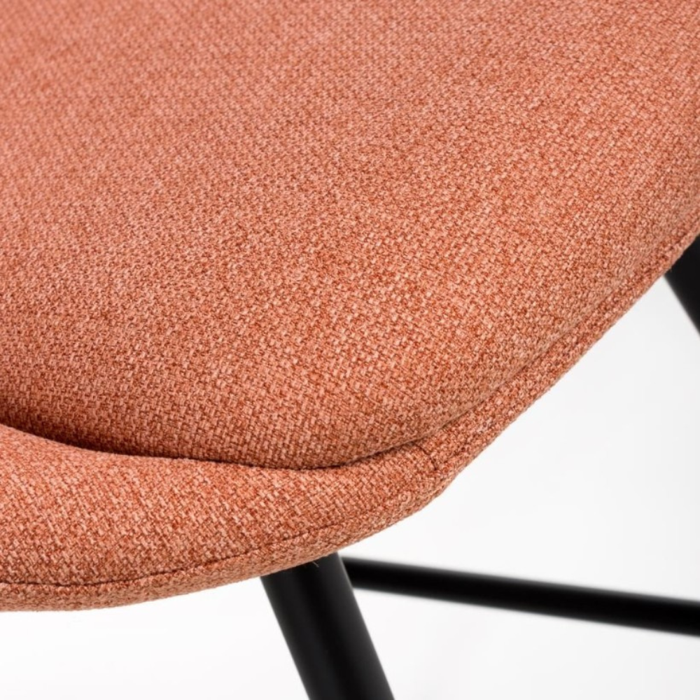 The Boden Bar Chair in Sage Green, Natural or Brick offers luxurious fabric comfort, chic pleated details, robust black metal legs