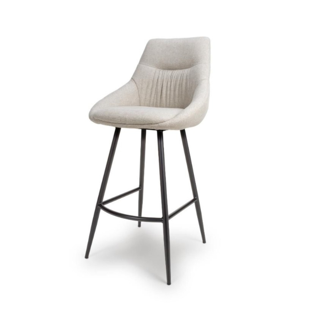 The Boden Bar Chair in Sage Green, Natural or Brick offers luxurious fabric comfort, chic pleated details, robust black metal legs