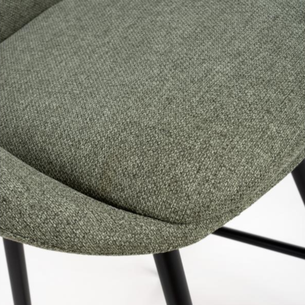 The Boden Bar Chair in Sage Green offers luxurious fabric comfort, chic pleated details, robust black metal legs