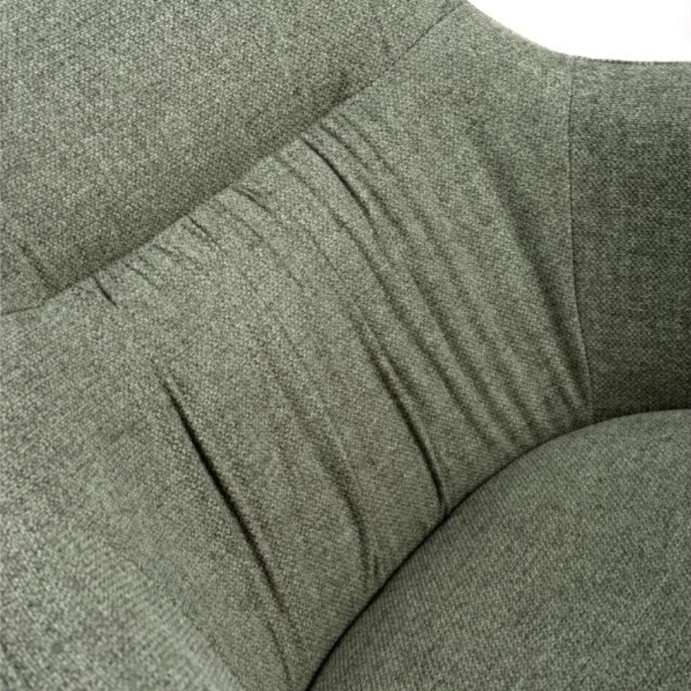 The Boden Carver Chair in Sage Green blends modern style with comfort, plush fabric upholstery, sleek metal legs