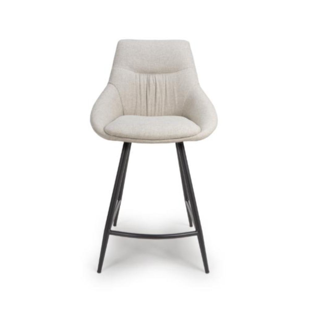 The Boden Counter Chair in Natural features soft upholstery, sophisticated pleats and strong black metal legs