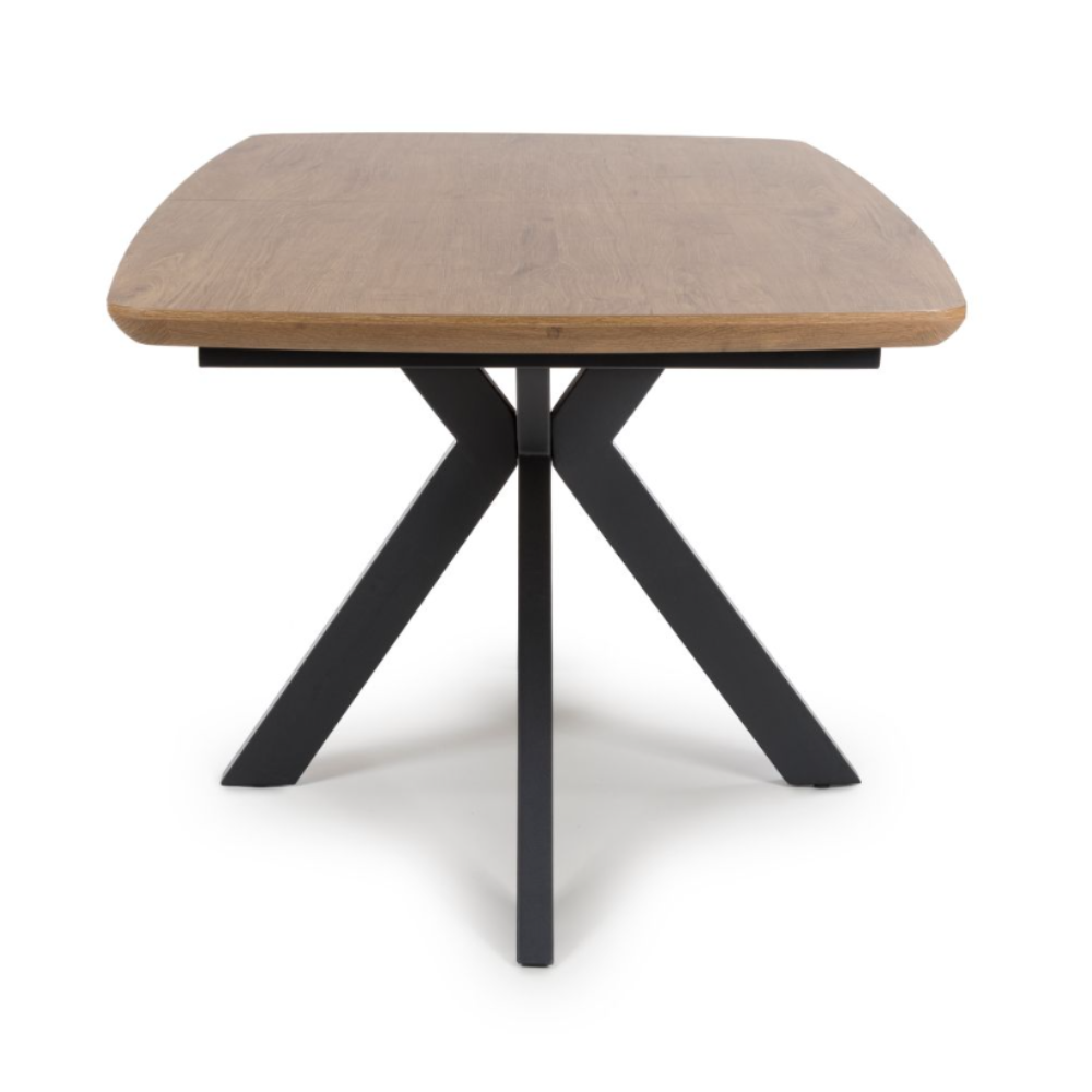 The Boston Extending Table which can be adjusted from 1600mm to 2000mm, showcases a charming rustic oak wood veneer complemented by black metal legs.