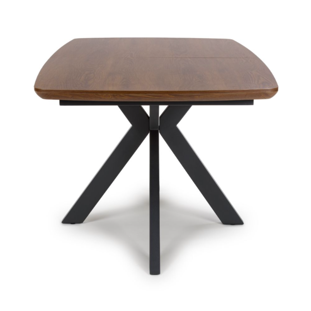 The Boston Extending Table, which can be adjusted from 1600mm to 2000mm, showcases a luxurious smoked oak veneer and robust metal legs.