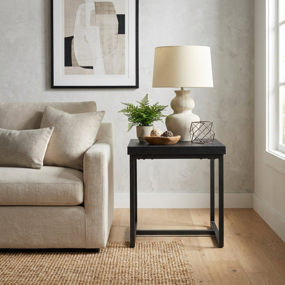 The Boston End Table in Black Ash boasts a robust SmarTops® surface, resilient iron legs and a stylishly compact design, an ideal addition to any setting.