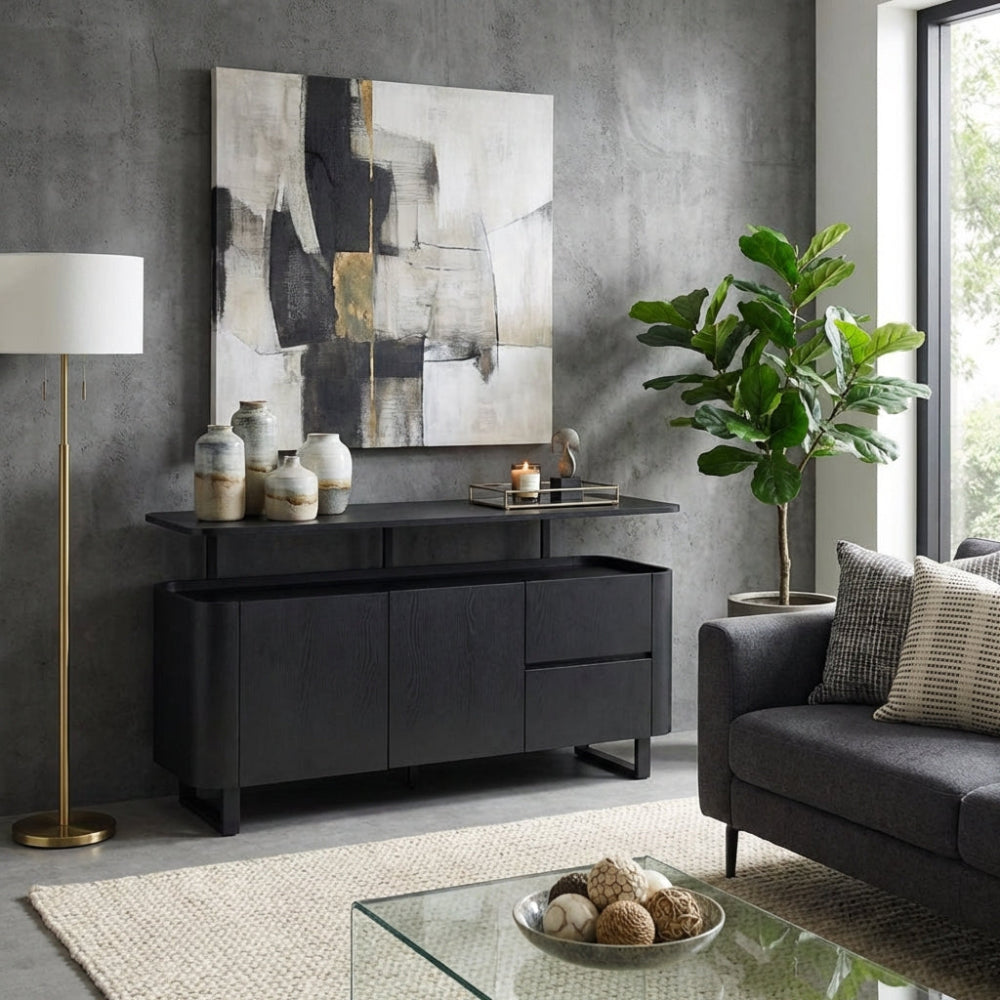 The Boston Sideboard in Black Ash boasts a SmarTops® resilient surface, elegant iron legs, and generous storage capacity.