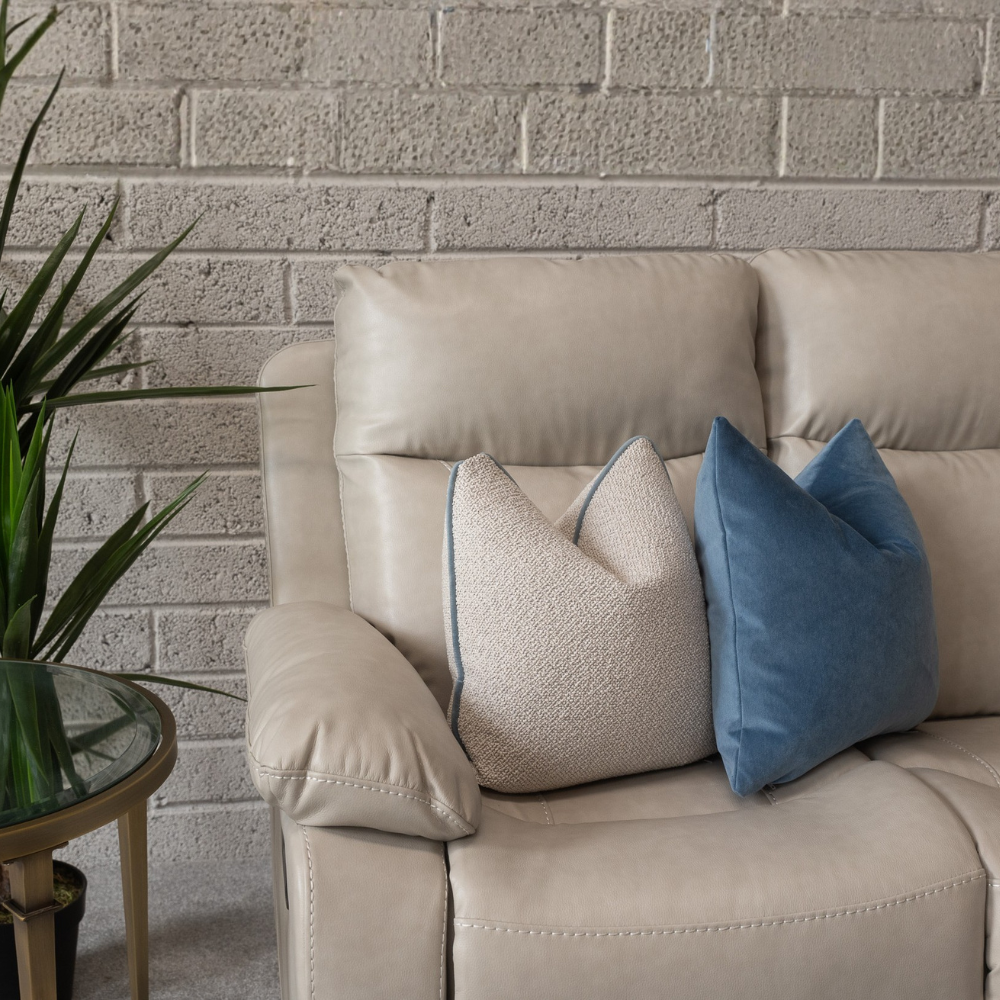 The Brittas Recliner Sofa in Beige Leathaire features padded headrests, armrests, multiple size options & nationwide delivery all over Ireland!