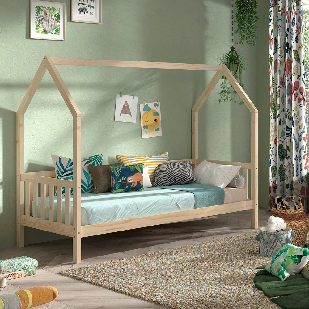 The Cabane House Bed 90 x 200cm in Natural pine features a playful design, side railing, fall protection and charm with solid wood & slat base included
