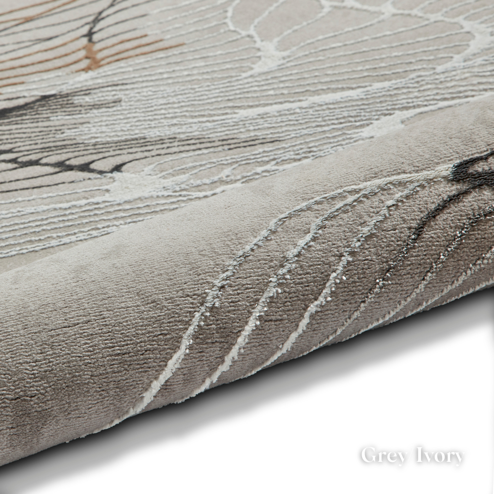 Elevate your style with the Creation Modern Abstract Machine Made Rugs Range featuring metallic yarn, textured piles and artistic pattern.