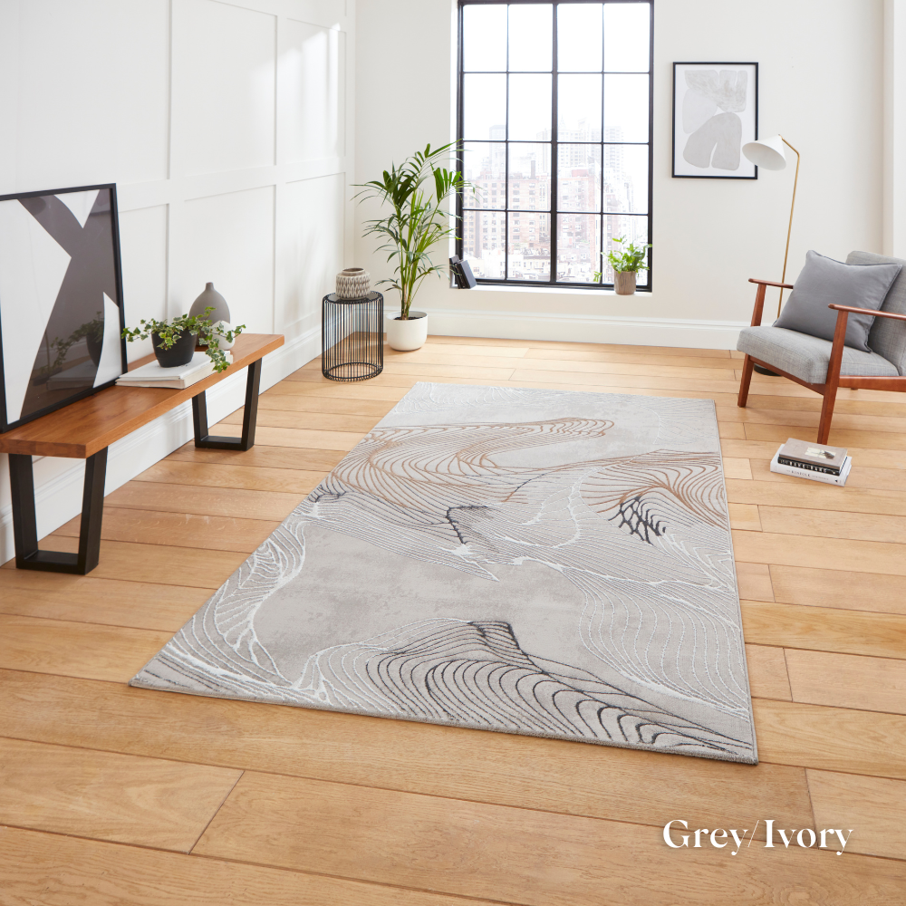 Elevate your style with the Creation Modern Abstract Machine Made Rugs Range featuring metallic yarn, textured piles and artistic pattern.