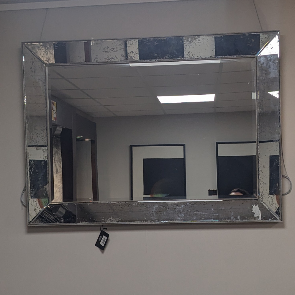 The Croften Rectangular Mirror with antique silver finish adds light space and timeless elegance to any room in your home