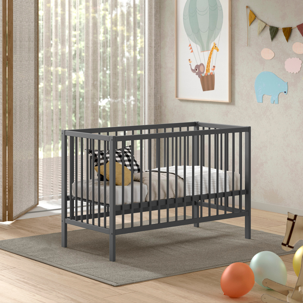 The Dino Baby Cot Bed 60 x 120cm in Anthracite features a smooth lacquered finish, European beech material and a 3 height adjustable slatted base