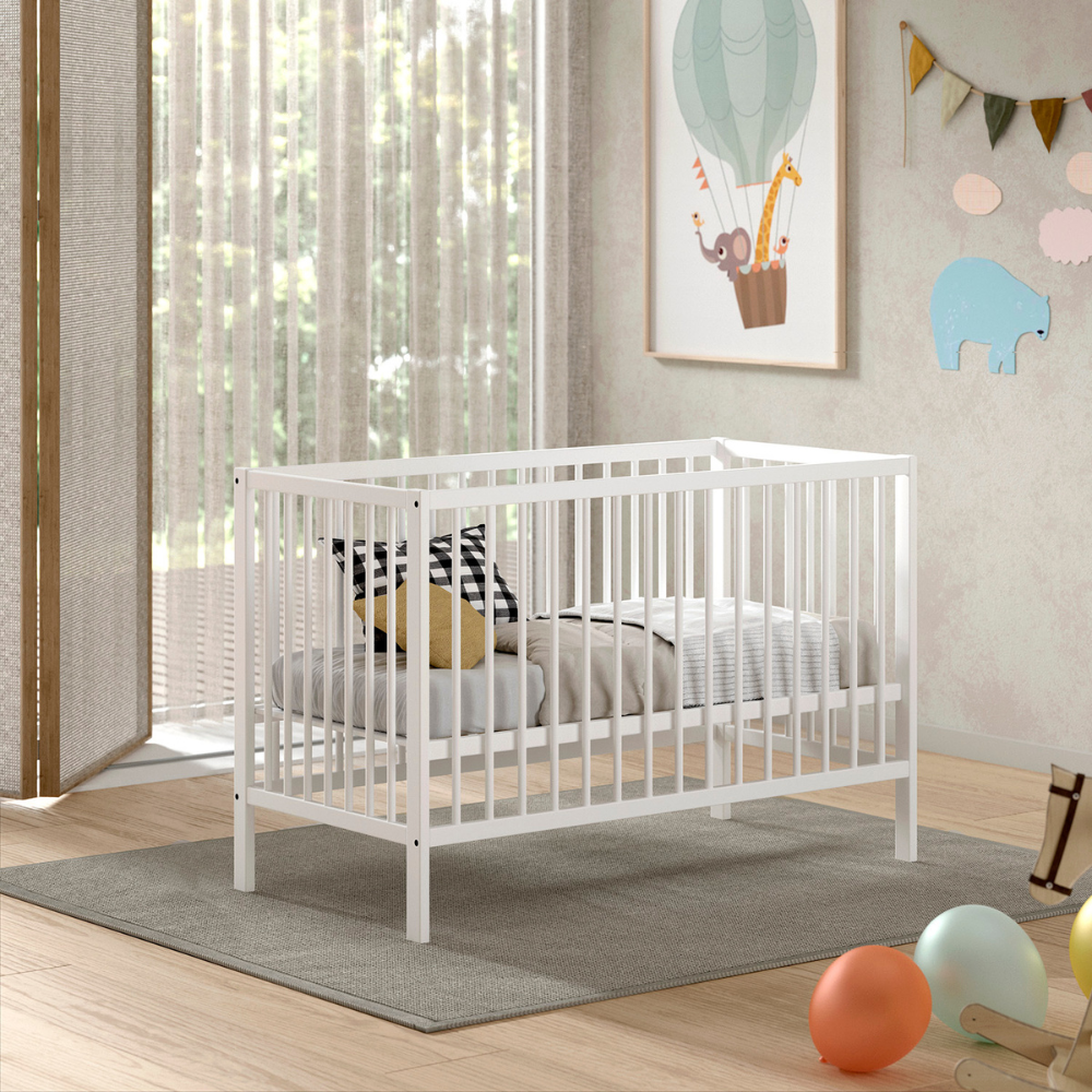 The Dino Baby Cot Bed 60 x 120cm in White features a smooth lacquered finish, European beech material and a 3 height adjustable slatted base