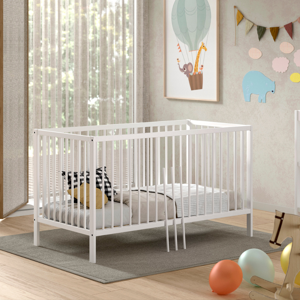 The Dino Baby Cot Bed 70 x 140cm in White features 3 height adjustable slat base, European beech material, removable bars and toddler bed conversion