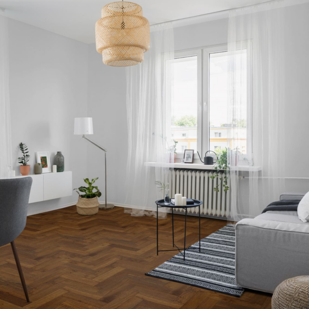 The Double Smoked Oak Herringbone Engineered Flooring - 15mm features deep smoked tones, rich grain detail and durable multi layer stability
