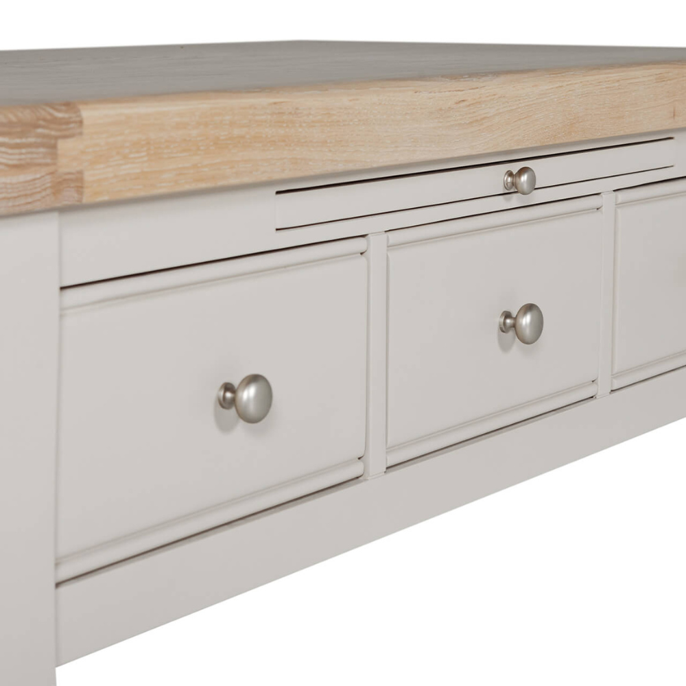 The Doune Coffee Table in Taupe features oak veneer top, three storage drawers with sleek handles and a versatile design.