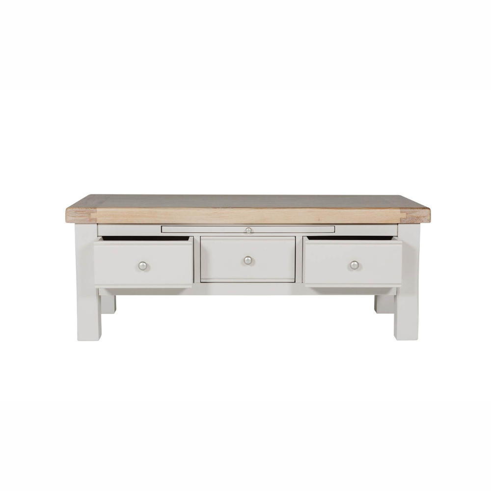 The Doune Coffee Table in Taupe features oak veneer top, three storage drawers with sleek handles and a versatile design.