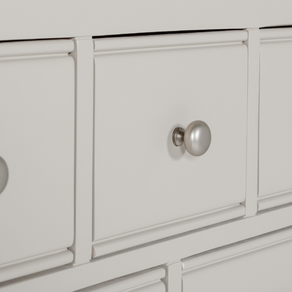 The Doune 6-Drawer Dressing Chest in Taupe features 6 spacious drawers, oak veneer top and sleek metal handles.
