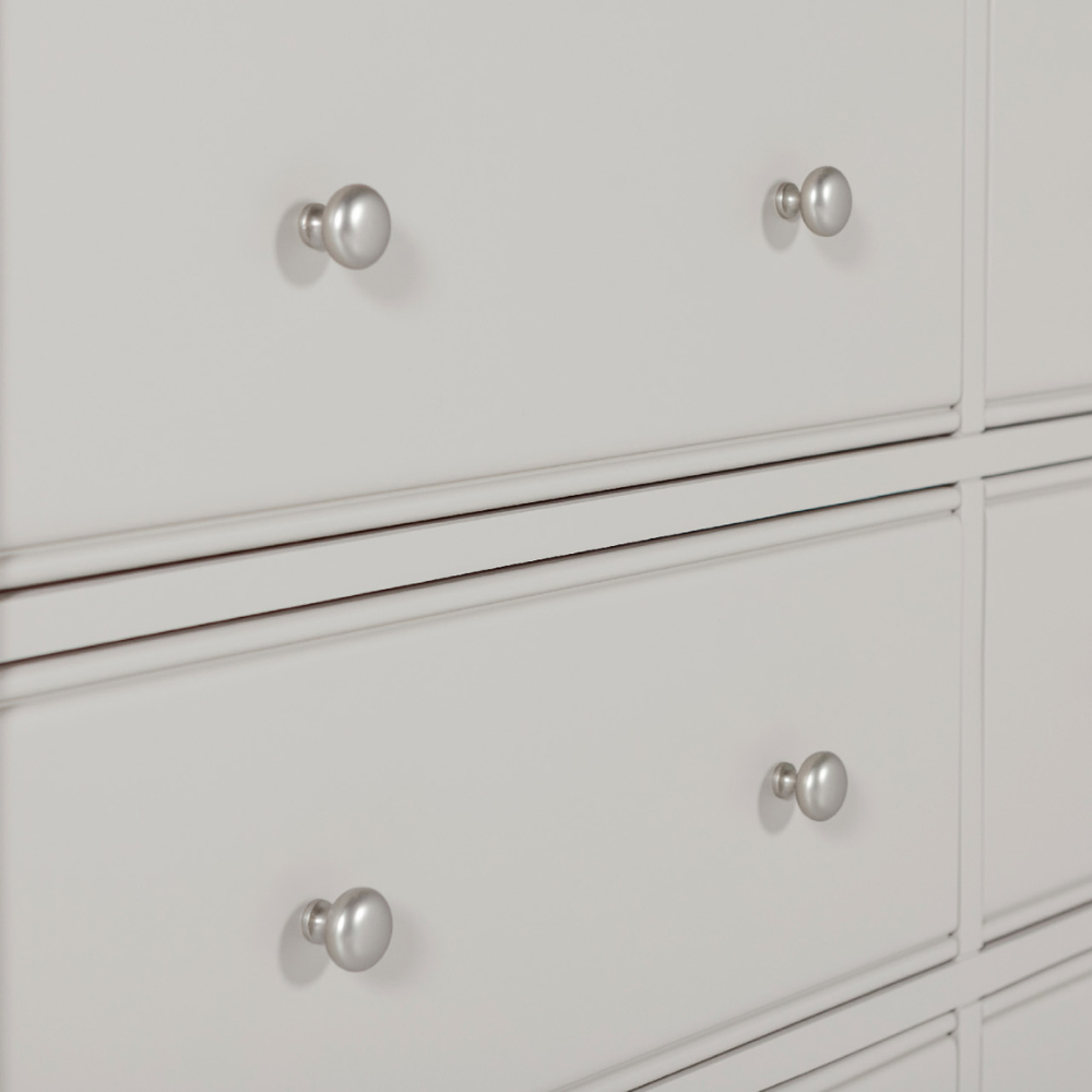 The Doune 6-Drawer Dressing Chest in Taupe features 6 spacious drawers, oak veneer top and sleek metal handles.