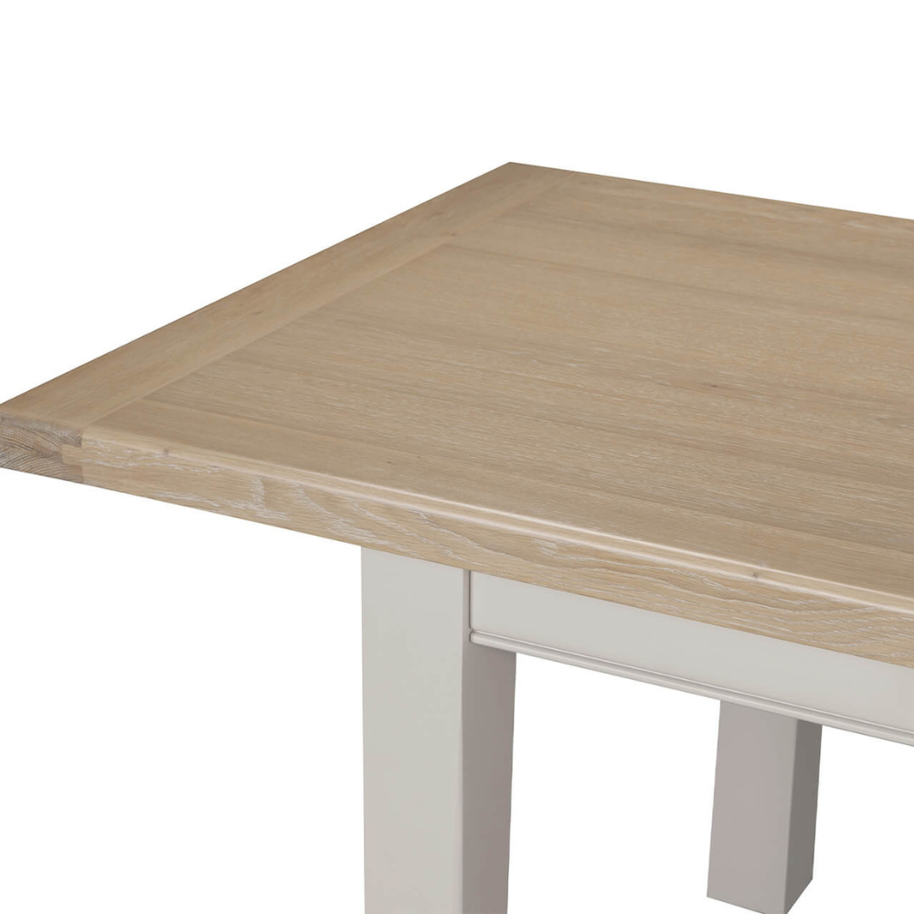 The Doune 1200/1650 Extending Dining Table in Taupe features oak veneer top, taupe-painted legs and smooth extension