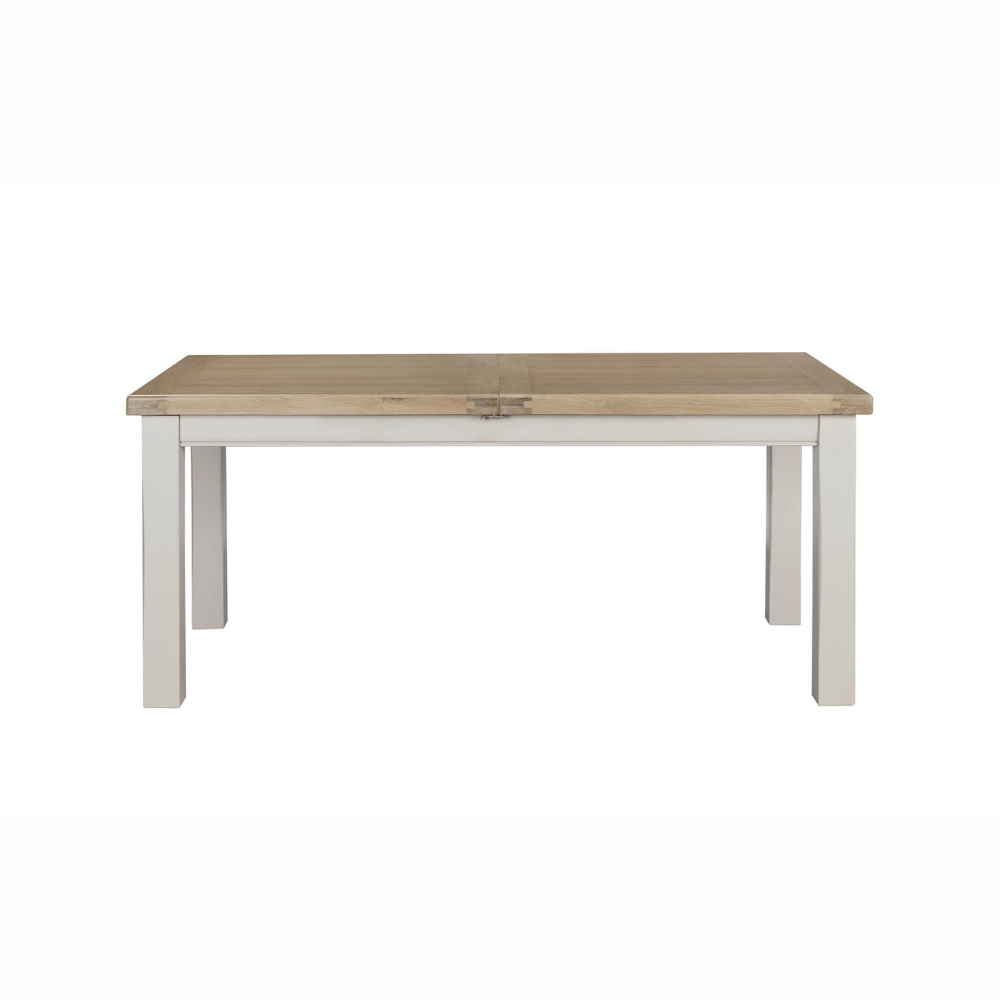 The Doune Extendable Dining Table in Taupe, 1800-2460mm features oak top, taupe-painted legs, and smooth extension mechanism.