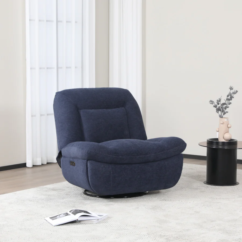 The Ebba Reclining Chair in Indigo is upholstered in a flat bouclé fabric, swivel function and electric recline for adjusting