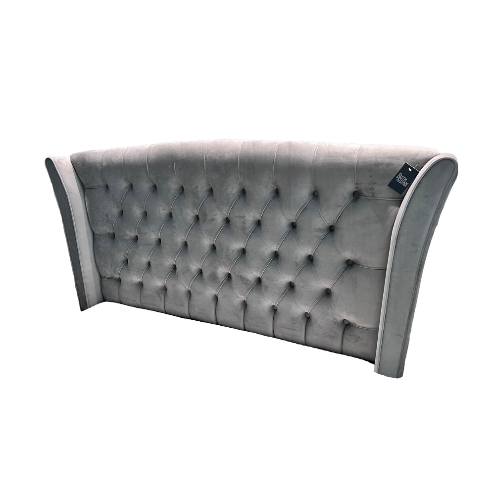The Eclipse Fabric Headboard - 56" features arched winged with deep buttons, custom fabric and floor standing with chrome gliders, ideal for any bed!