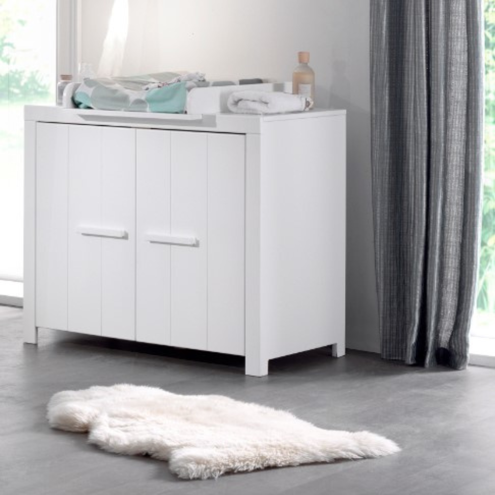 The Erik Baby Dresser with Changing Unit in White features a safe changing table space with 2 door storage, solid pine/MDF build and wall mount option