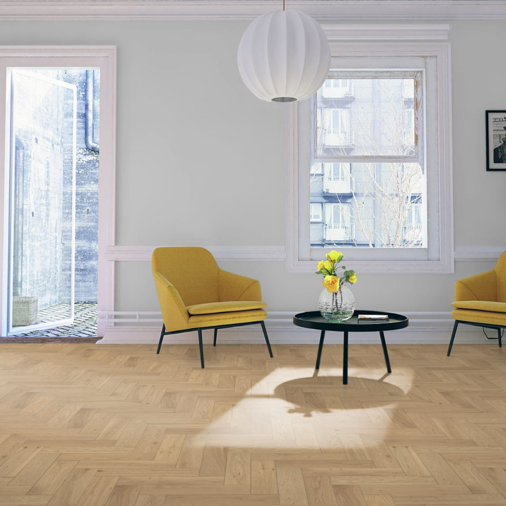 The Whisper Oak Herringbone Engineered Flooring - 15mm features warm oak tones, modern herringbone design and durable multi layer construction