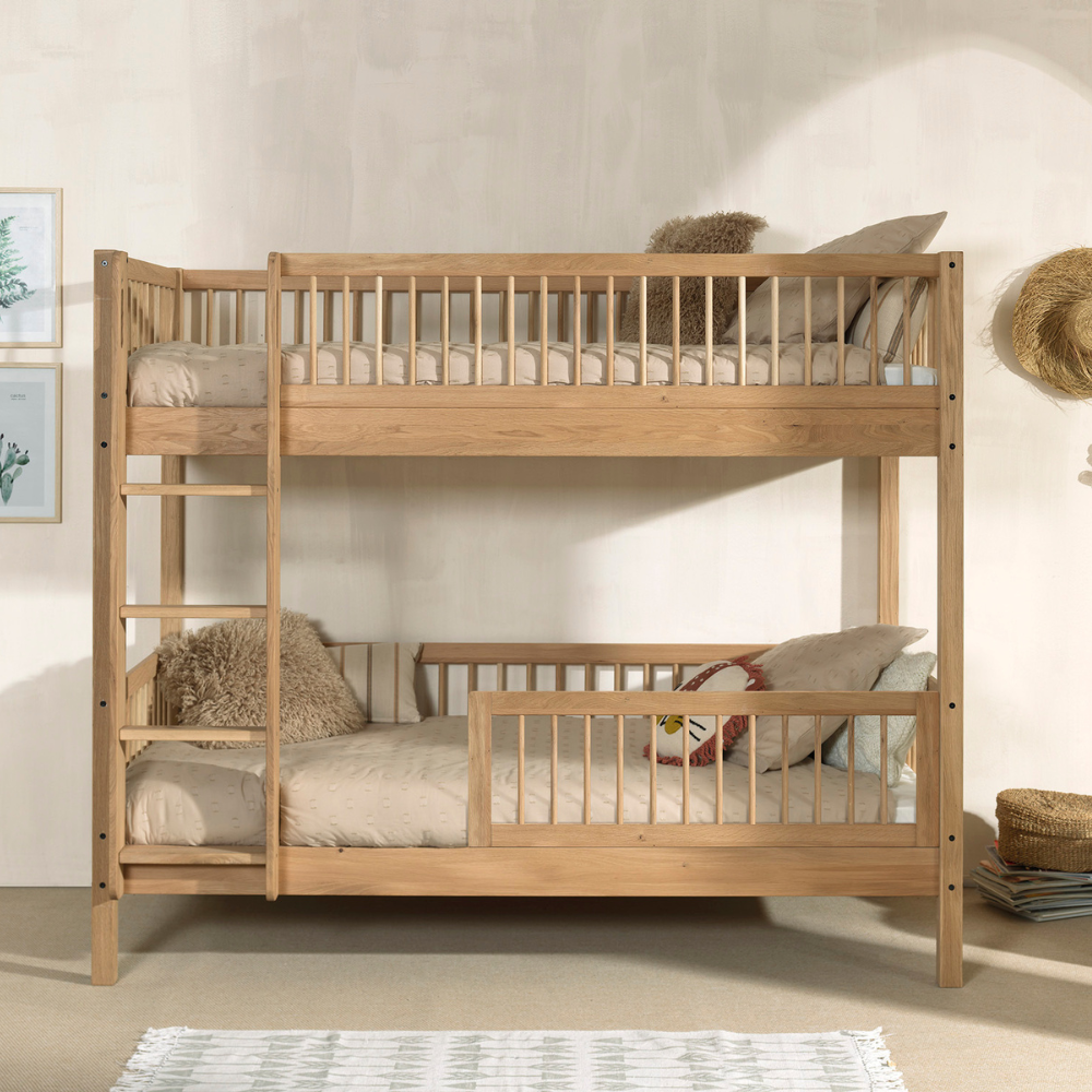 The Forrest Oak Kids Bunk Bed with Safety Rail offers strong oak material, a safety rail for added protection and a natural lacquered finish