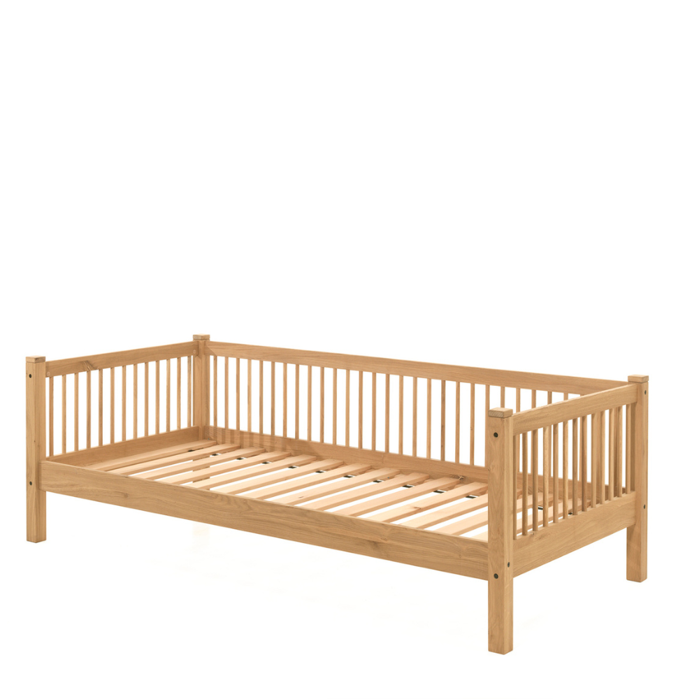 The Forrest Oak Kids House Bed Set with a Textile features a, textile draped over the roof, 3 side guardrail & a sturdy oak frame, ideal for kids aged 4+