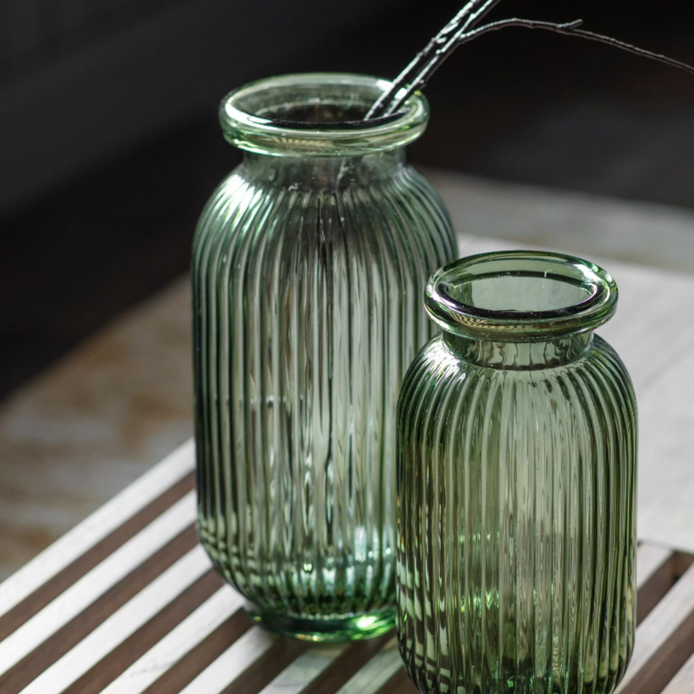 The Gallery Francia Large Vase in Green offers a ribbed texture and stylish shape, adding elegance and beauty to any room.