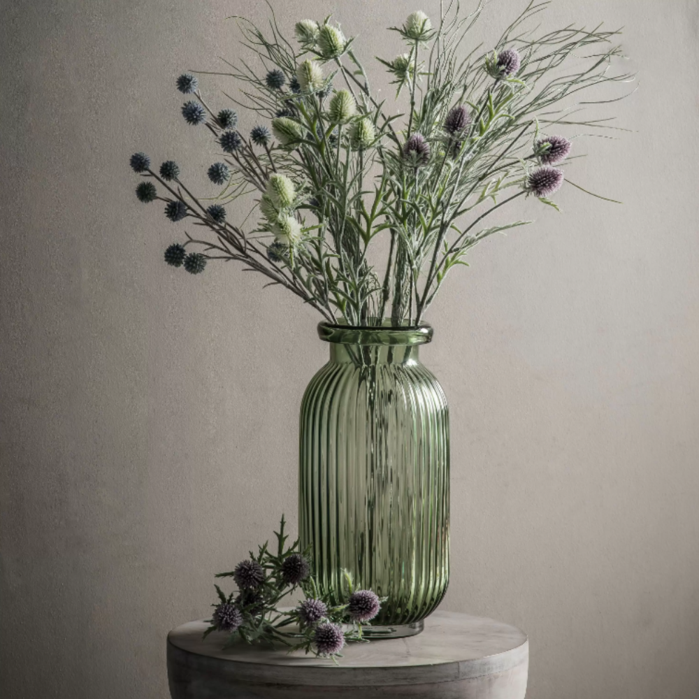 The Gallery Francia Large Vase in Green offers a ribbed texture and stylish shape, adding elegance and beauty to any room.