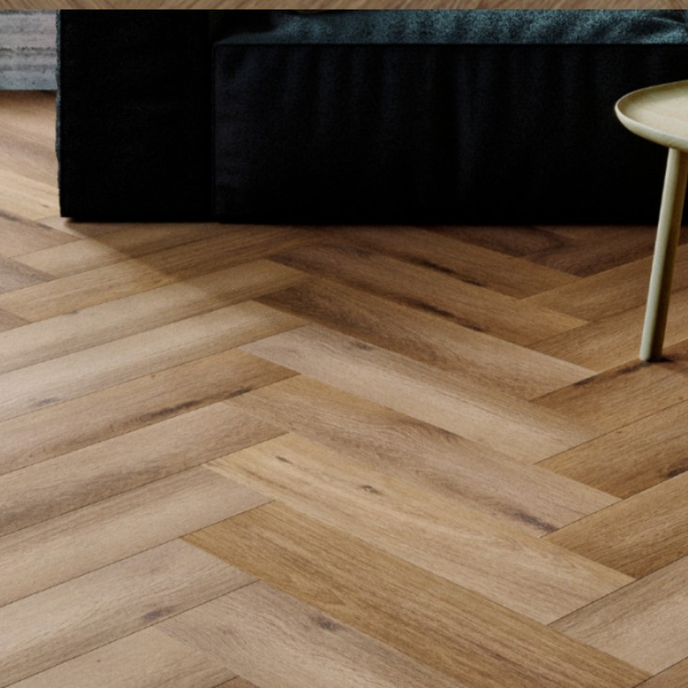 The Georgetown Oak Herringbone SPC Flooring features a timeless oak design, suitable for underfloor heating, Titanium Nano finish and a 25 year warranty