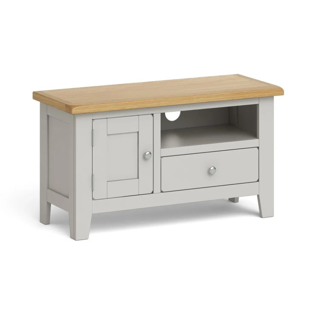 The Guildford Small TV Unit features an oak top, shaker legs, soft grey finish, open shelf, drawer and cupboard for a charming, practical media storage