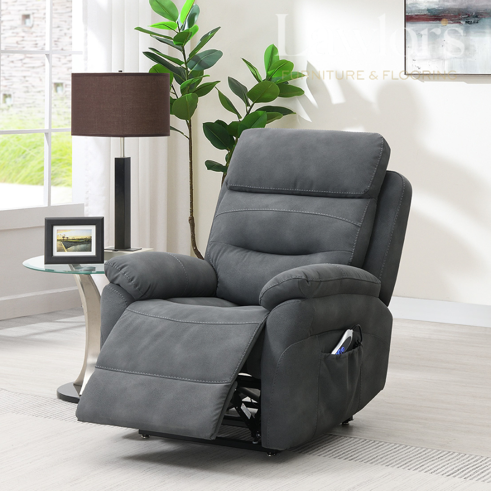 Dark Grey life & rise recliner chair in a living room setting with a lamp, plant, and framed picture.