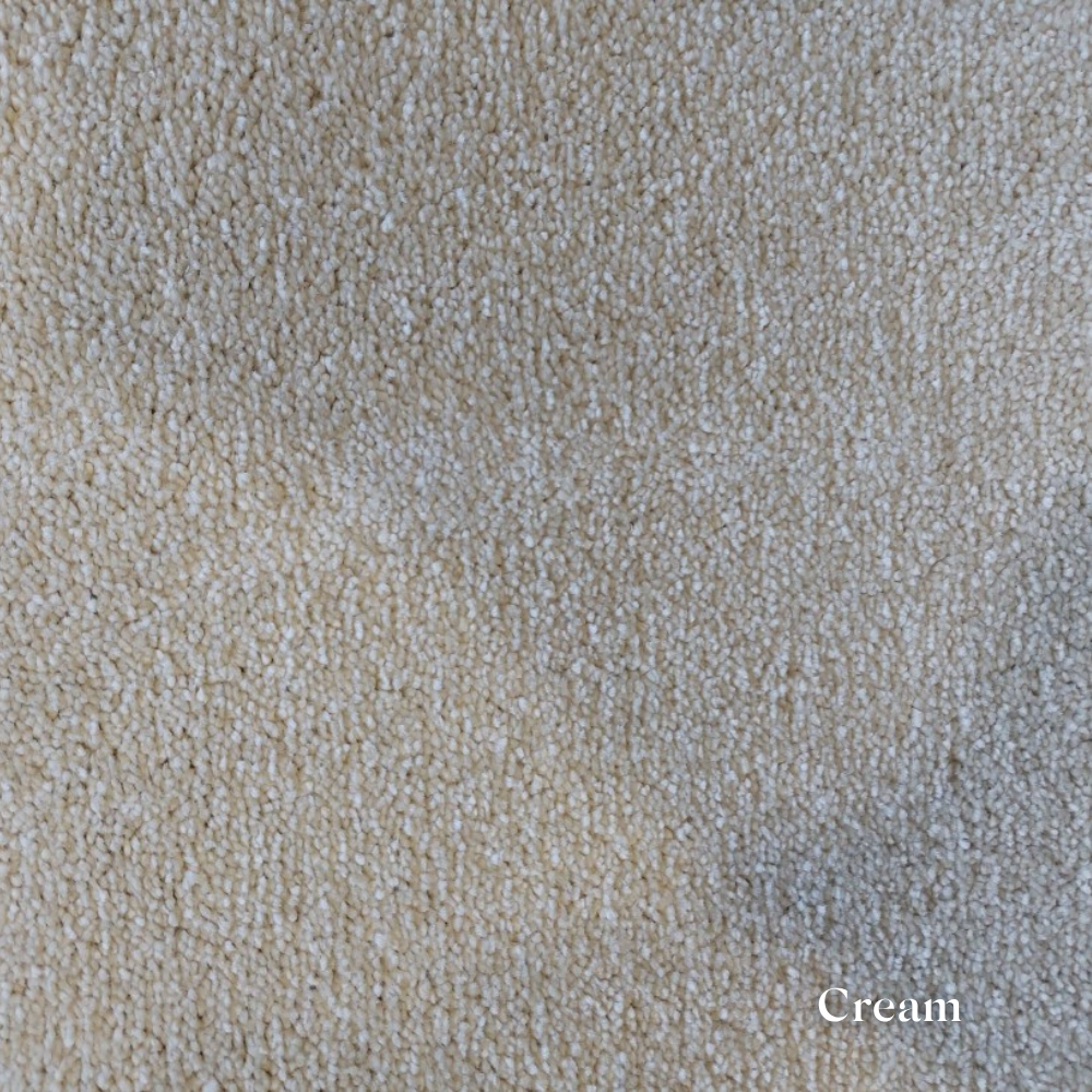 Close-up of cream-colored textured fabric with 'Cream' label
