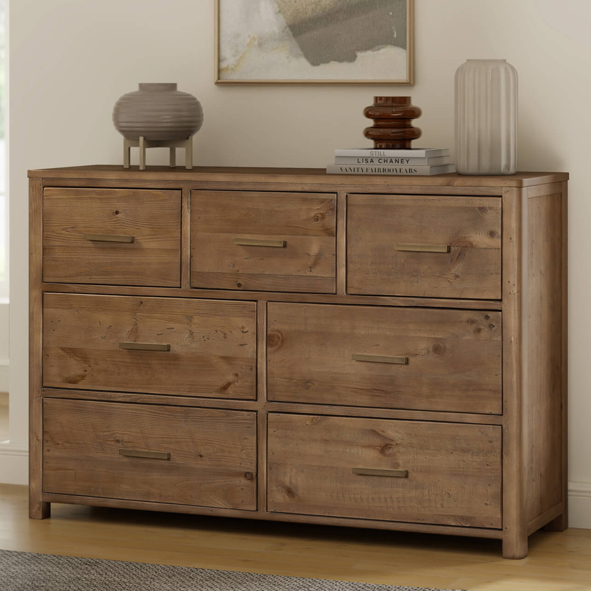 Wooden dresser with multiple drawers in a room setting.