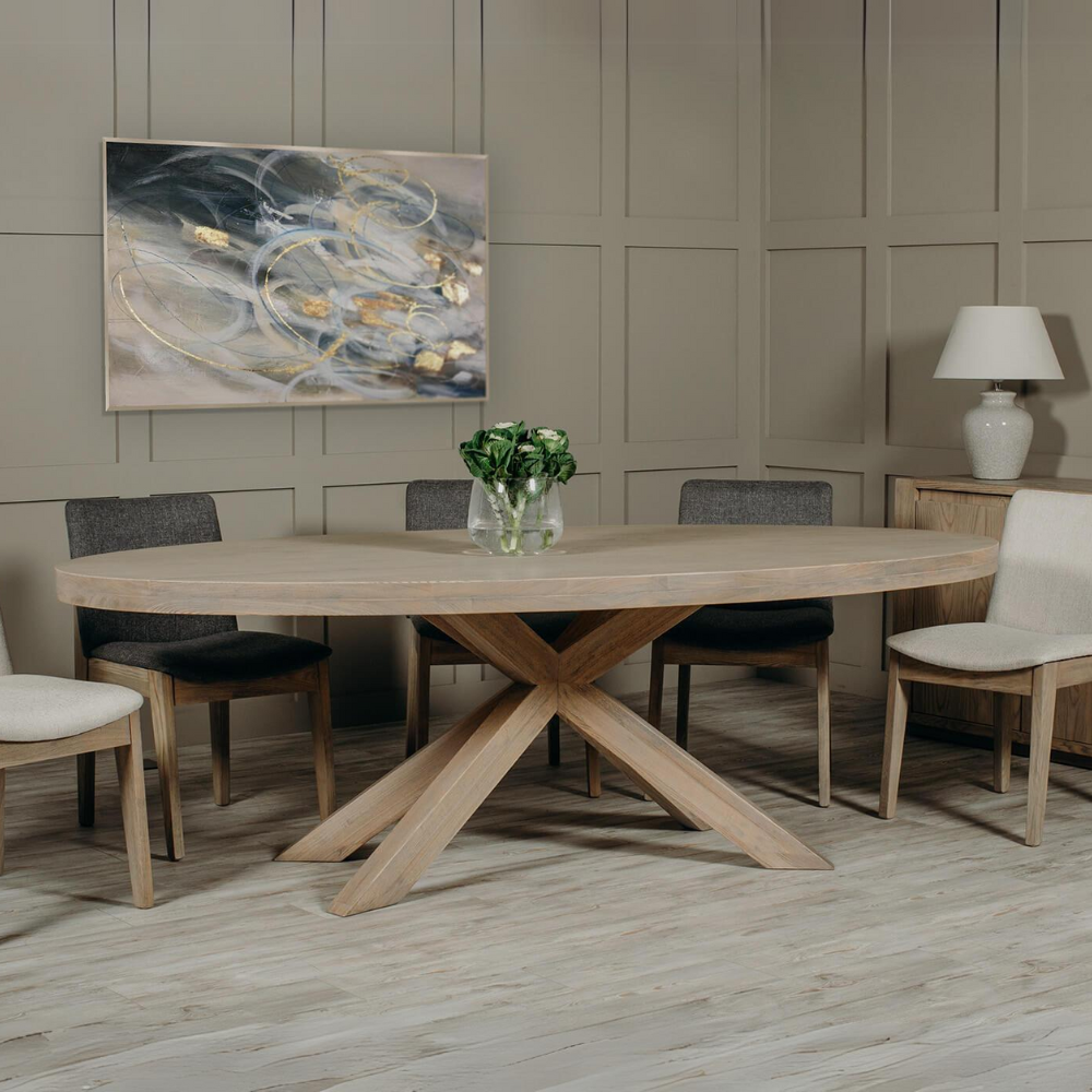 The Foxford Large Oval Dining Table in Smoked Oak is crafted with stylish smoked oak veneer and supported by solid oak legs