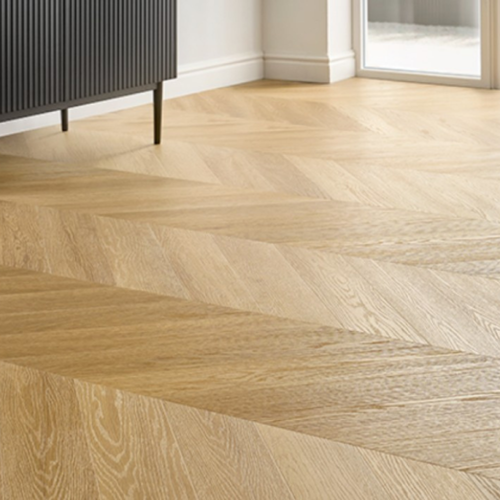 The Menor Oak Chevron SPC Flooring features elegant chevron design, waterproof mineral core, 25 year warranty and Titanium Nano finish for durability