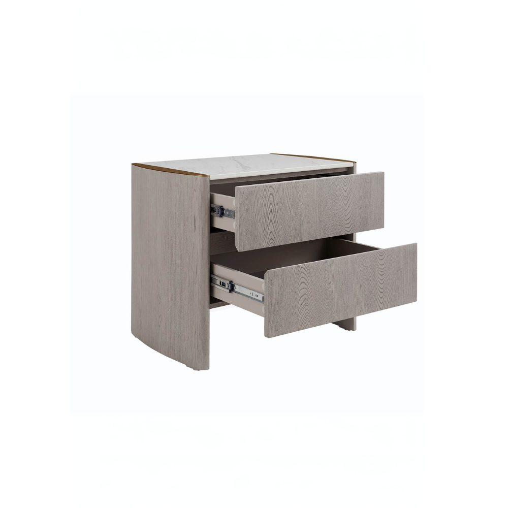 The Mondello 2 Drawer Bedside Table in Washed Oak features a luxurious sintered stone top, stainless steel accents and ample storage for a modern bedroom