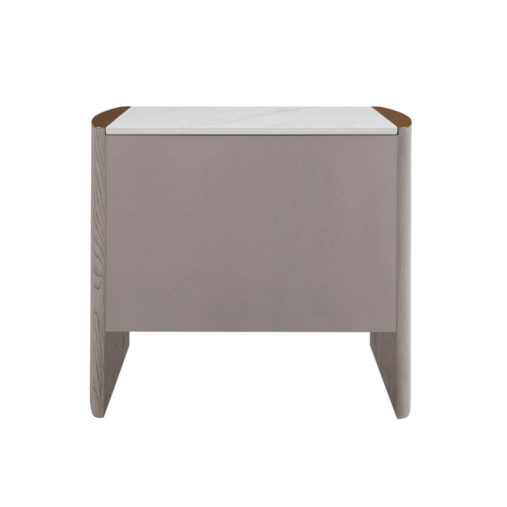 The Mondello 2 Drawer Bedside Table in Washed Oak features a luxurious sintered stone top, stainless steel accents and ample storage for a modern bedroom