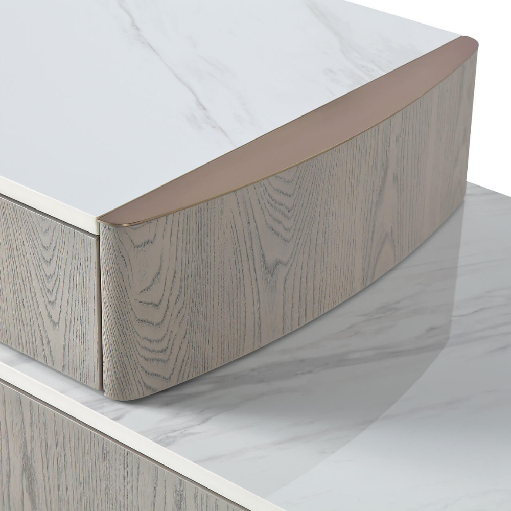 The Mondello 5 Drawer Dressing Table in Washed Oak features a sintered stone top, adjustable width and ample storage where luxury meets versatility