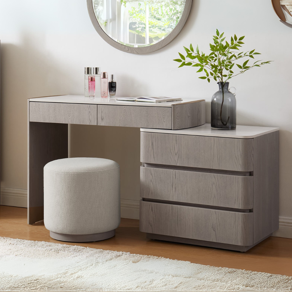 The Mondello 5 Drawer Dressing Table in Washed Oak features a sintered stone top, adjustable width and ample storage where luxury meets versatility