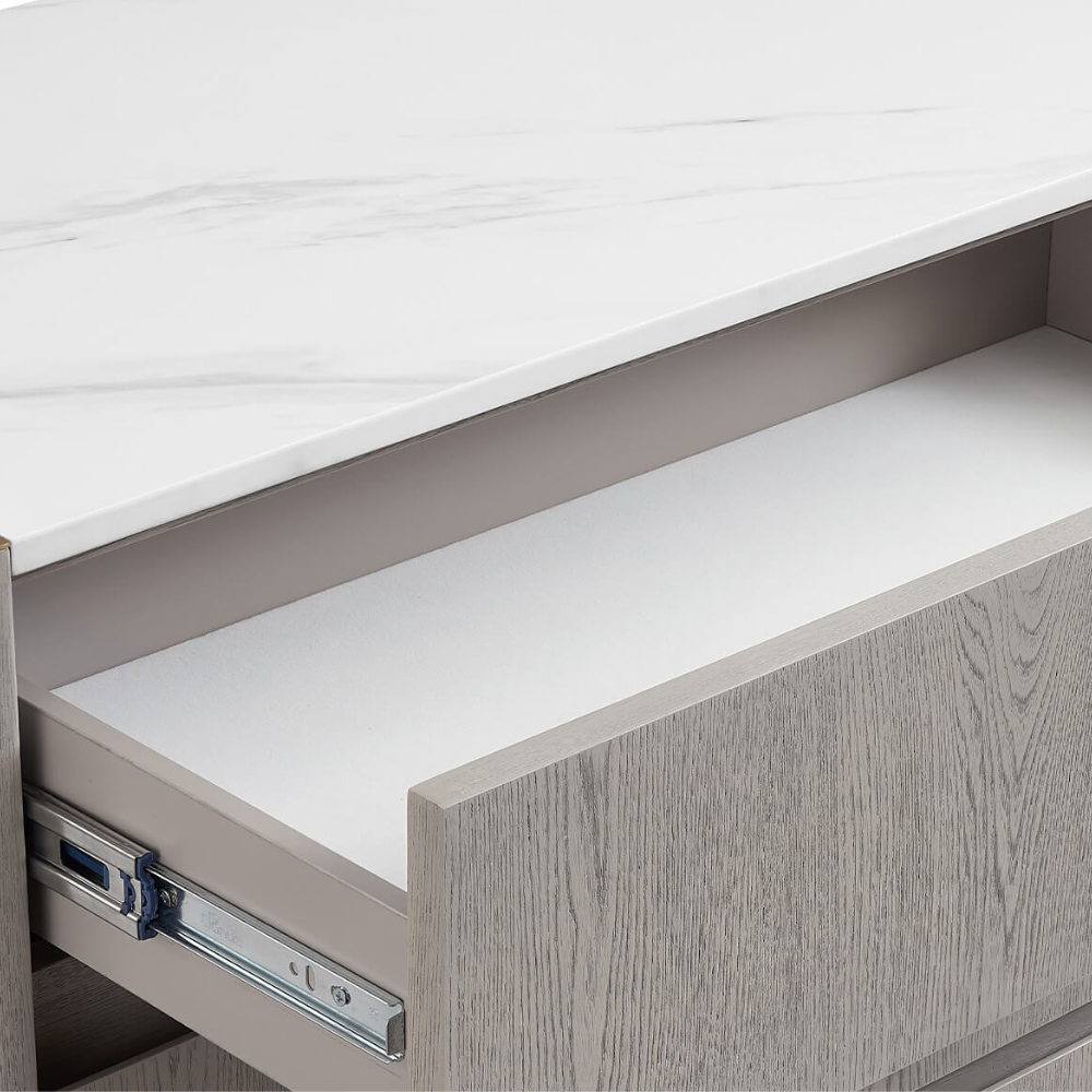 The Mondello 6 Drawer Chest in Washed Oak features a durable sintered stone top, luxurious detailing and 6 spacious drawers for style and functionality