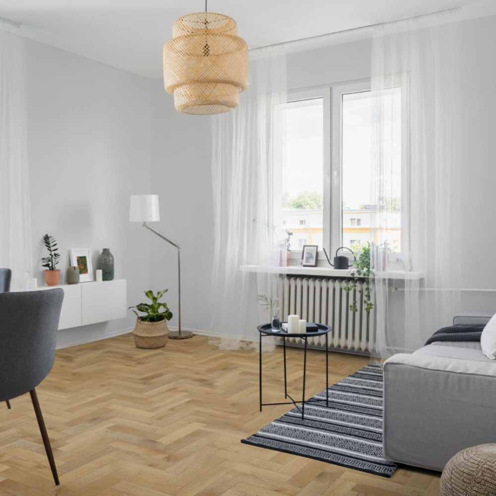 The Orchid White Oak Herringbone Engineered Flooring - 15mm features white grain detail, durable multi layer construction and flexible installation