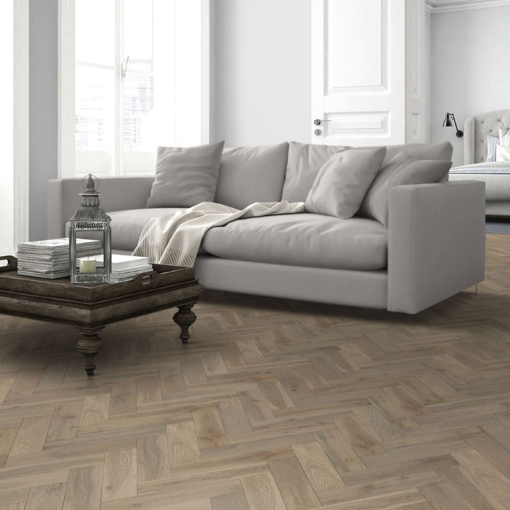 The Pearl Grey Oak Herringbone Engineered Flooring - 15mm features natural oak grains, multi layer stability and a brushed lacquer finish