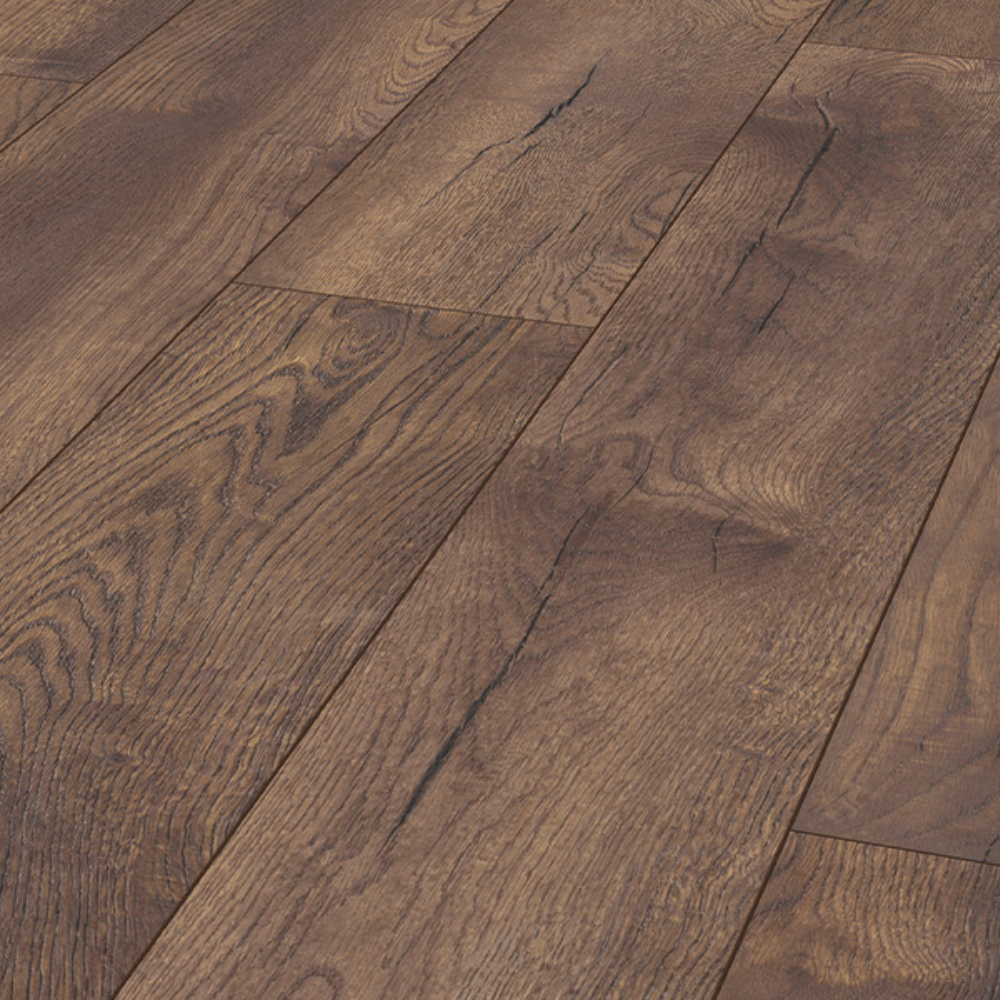 The Pettersson Oak Dark Laminate Flooring - 12mm features AC5-rated, embossed oak finish and a 30-year residential warranty.