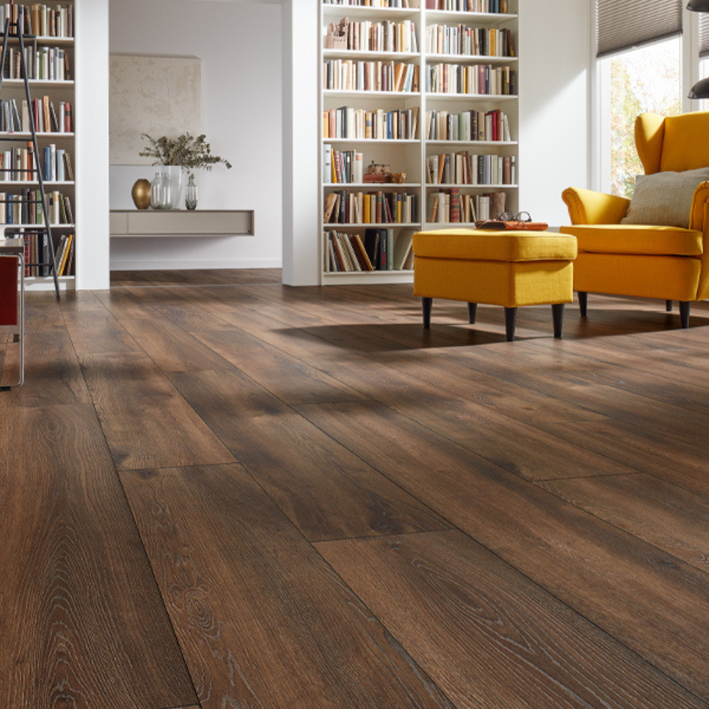 The Pettersson Oak Dark Laminate Flooring - 12mm features AC5-rated, embossed oak finish and a 30-year residential warranty.
